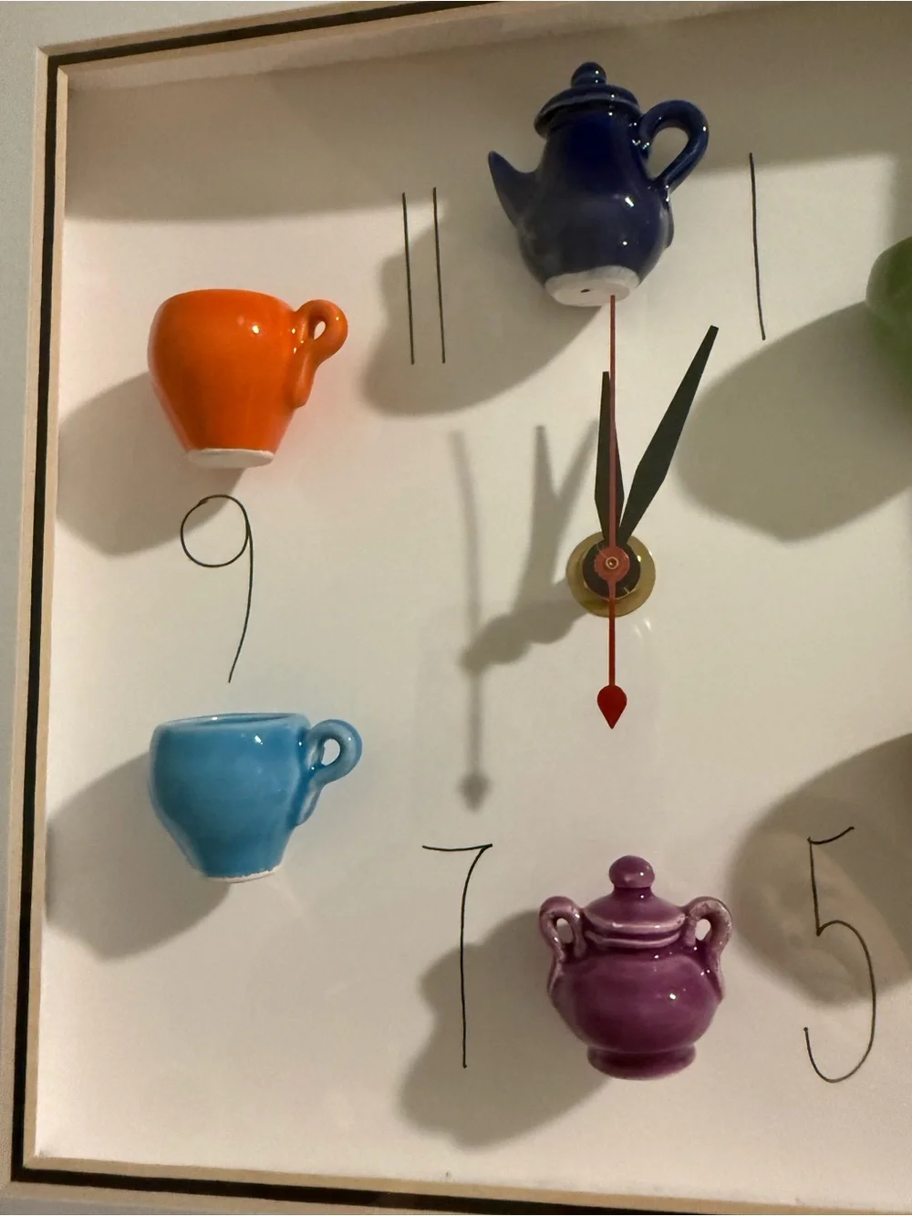 This 10x10 inch shadowbox wall clock, signed by artist Carlos Silva of Centuries